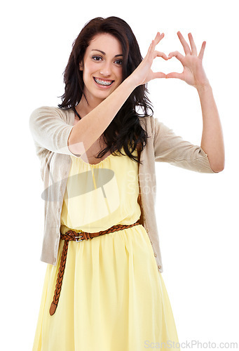 Image of Woman, portrait and heart hands for thank you in studio, kindness and peace emoji or symbol. Happy female person, support icon and smiling on white background, romance emoticon and gratitude for care