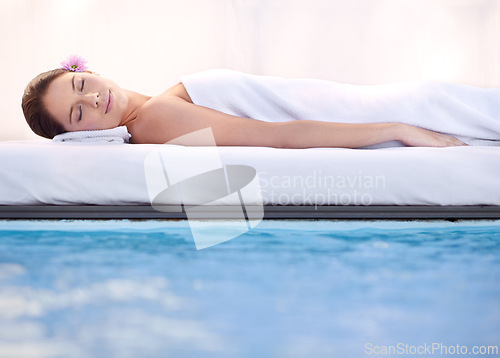 Image of Relax, sleep and woman at spa pool with massage for health, wellness balance and luxury holistic treatment. Self care, peace and girl on poolside bed for body therapy, comfort and calm hotel service