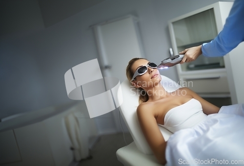 Image of Modern woman undergoes laser hair removal therapy, embracing contemporary beauty techniques for smooth and hair-free skin.