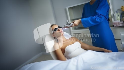 Image of Modern woman undergoes laser hair removal therapy, embracing contemporary beauty techniques for smooth and hair-free skin.