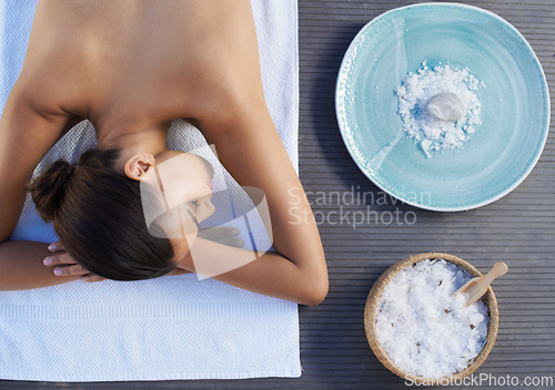 Image of Sleeping, salt or woman in spa or resort with bowl for wellness, treatment or hospitality. Relax, top or healing therapy for happy person, client or masseuse in hotel on break or holiday vacation