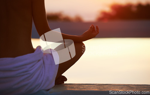 Image of Back, yoga and hands meditate at sunset by swimming pool for healthy body, wellness and zen outdoor on mockup space. Rear view, lotus pose and person by water at twilight to relax, peace and calm