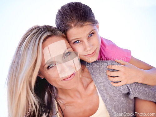Image of Mother, daughter or portrait with piggyback in studio for bonding, support or hug on holiday with smile. Family, woman and girl child with face, happy or embrace with love or care on white background