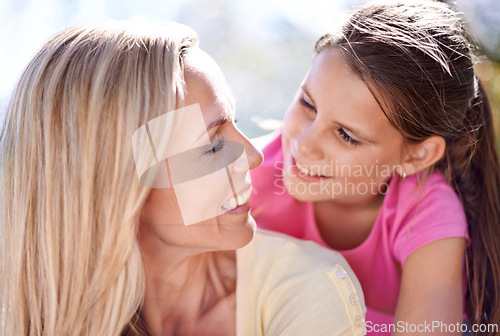 Image of Mother, girl child and happiness outdoor with bonding for support, hug and trust on holiday in nature. Family, woman and daughter with face, smile and embrace on vacation, travel and love with fun