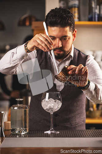Image of Expert bartender preparing a cocktail
