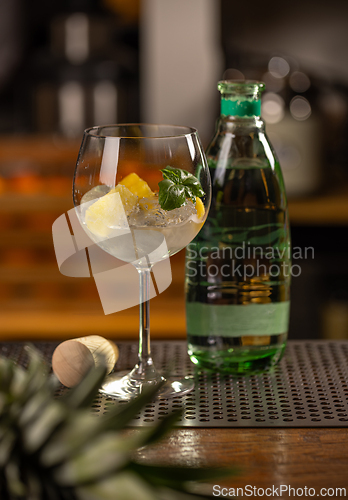 Image of Refreshing fruit infused water in elegant glass