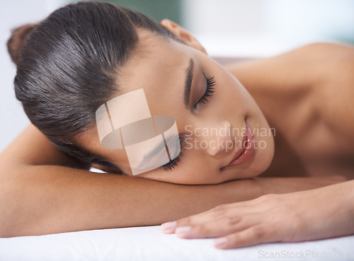 Image of Relax, sleeping and woman at spa with health, wellness and self care skin treatment for zen. Calm, cosmetics and young female person with beauty body routine taking nap on towel at luxury salon.