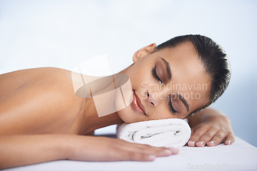 Image of Relax, sleeping and woman at spa with self care, wellness and luxury skin treatment for zen. Calm, cosmetics and young female person with beauty body routine taking nap on towel at health salon.