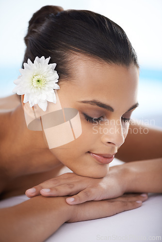 Image of Woman, massage and spa treatment for relaxing, wellness and beauty therapy for body care. Organic skincare, calm and serene or female person on bed, tranquil and resting at resort and peace or zen