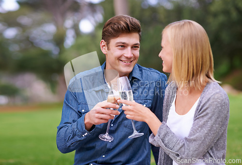 Image of Park, picnic and cheers with couple, love and celebration with happiness and bonding together for Valentines day. Outdoor, man and woman with champagne and anniversary with romance and countryside