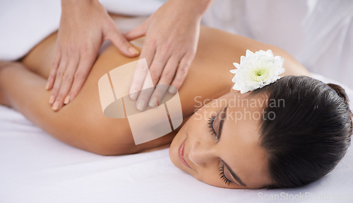 Image of Woman, back massage and beauty treatment at spa, wellness and muscle therapy for body care. Female person, masseuse and health by dermatology, calm and resting at resort hotel and peace or zen
