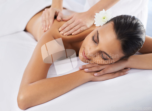 Image of Woman, back massage and body treatment for healing, wellness and muscle therapy for bodycare. Female person, masseuse and health by dermatology, calm and resting at resort hotel and peace or zen