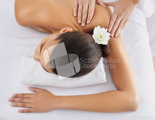 Image of Woman, back massage and spa treatment for relaxing, wellness and physical therapy for body care. Top view, hands and nudity of female person on bed, beauty and resting for skincare and peace or zen