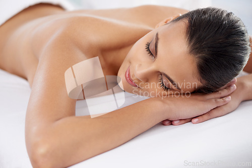 Image of Relax, nap and woman at spa with health, wellness and luxury skin treatment for zen. Calm, cosmetics and young female person with self care body routine taking nap on towel at beauty salon for peace.