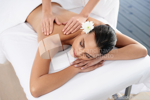 Image of Woman, back massage and body treatment for relaxing, wellness and muscle therapy for bodycare. Female person, masseuse and health by dermatology, calm and resting at resort hotel and peace or zen