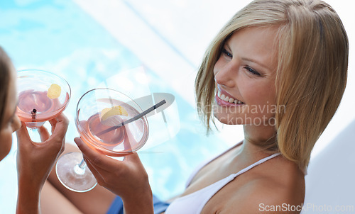 Image of Swimming pool, friends and women with cocktails, relaxing and conversation with a smile and excited. Girls, outdoor and water with people or alcohol drinks with discussion and joy with celebration