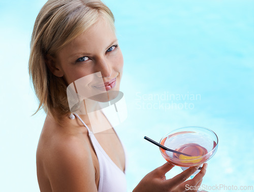 Image of Smile, portrait and woman at pool with cocktail, sunshine and travel for summer holiday at hotel. Relax, water and face of happy girl on luxury vacation with drink, weekend and swimming in high angle