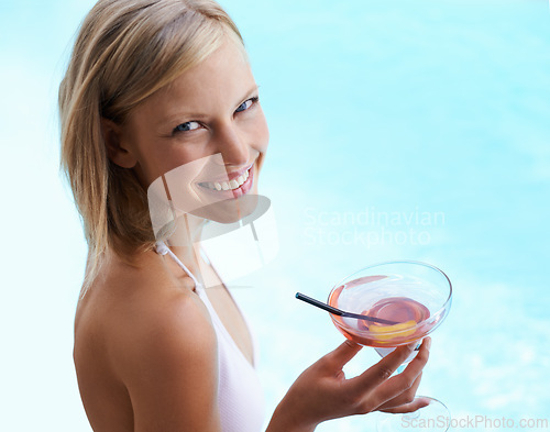 Image of Smile, portrait and woman at swimming pool with cocktail, sunshine and travel for summer holiday at hotel. Relax, water and face of happy girl on luxury vacation with drink, weekend and high angle.