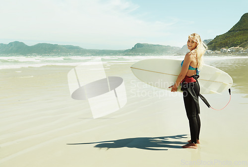 Image of Portrait, smile and woman with surfboard at beach on space for sports, travel or hobby in summer. Fitness, surfing and vacation with happy young person on tropical coast for holiday or island getaway