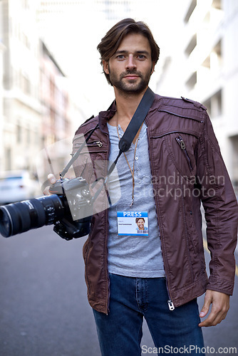 Image of Press, photographer and portrait with camera outdoor in city for photoshoot with gear to film on street. Travel, photography and creative cameraman shooting with lens to capture urban media on road