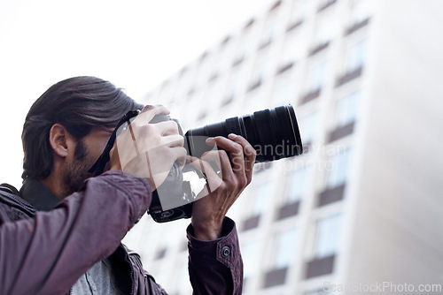 Image of Photographer, work and paparazzi man in city for press, travel and filming memory of adventure with camera. Professional, cameraman and capture creative photography with lens outdoor in photoshoot