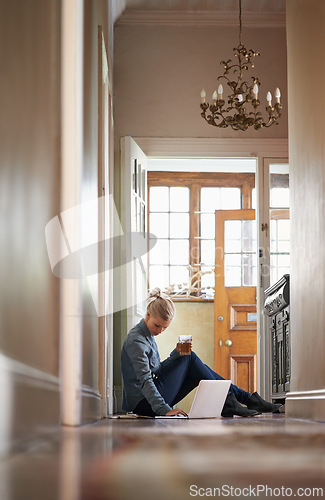 Image of Woman, drink or laptop on floor for remote work and internet connection for information. Freelancer, relax or female editor on website for research or online news or typing an article on technology