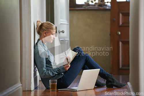 Image of Woman, floor or writing notes for remote work or internet connection with laptop, blog or post. Freelancer, relax or female editor with notebook for research or working on article in journal or diary