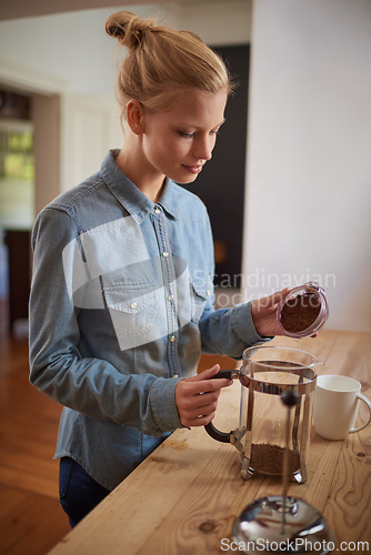 Image of Woman, coffee and french press in kitchen or prepare with plunger for morning beverage, caffeine or drinking. Female person, counter and breakfast equipment with mug for espresso, cappuccino or home