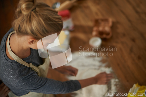 Image of Woman, baking and relax in a kitchen with flour and dough for bread in a home. Food, above and cooking a dessert in a house with wheat powder, nutrition and lunch recipe on a table with a baker