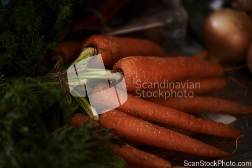 Image of Closeup, carrot and food for health and cooking, wellness and nutrition with vegan or vegetarian meal prep. Orange vegetables, organic produce and cuisine with dinner or lunch ingredients for diet