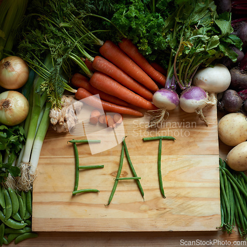 Image of Food, chopping board and message for eating, nutrition and cooking for wellbeing or love. Home, wellness and vegetables for diet, health and vitamins in kitchen for vegan, vitality and still life