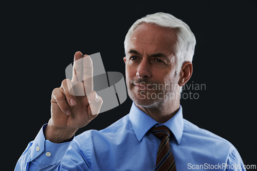 Image of Business man, finger and press interface for choice isolated on a black studio background. Touch, professional and hand gesture on screen, click and future innovation of technology for senior CEO