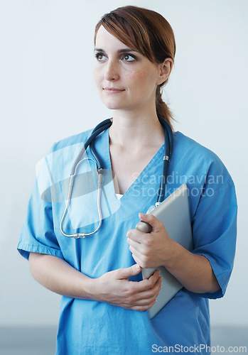 Image of Nurse, woman and thinking with tablet in studio for healthcare, wellness and medic for medicare. Female medical physician, digital touchscreen tech and professional nursing expert for telehealth