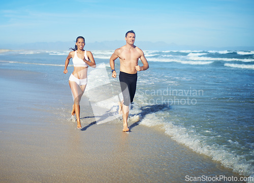 Image of Running, beach and couple with fitness, cardio and weekend break with sunshine and training for health. Runners, seaside and man with woman or workout with practice and activity for wellness or hobby