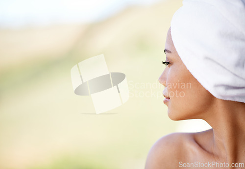 Image of Woman, thinking and spa with towel outdoor with calm and peace from beauty and skincare treatment. Mockup, hotel and wellness with skin, glow and wellbeing at resort with facial and cosmetics care