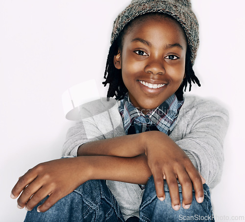 Image of Boy, fashion and portrait with gen z, trendy and cool style with a smile in a studio. Child, happy and African male kid from Chicago with confidence and modern youth outfit with white background