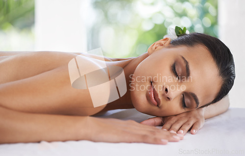 Image of Relax, peace and woman at spa for skincare, massage and calm at table to rest for zen at luxury resort. Beauty, therapy and young person at salon for healthy body, treatment and pamper for wellness