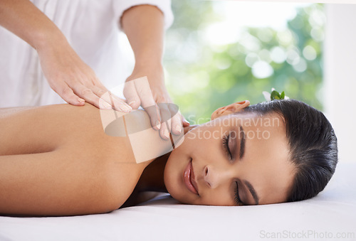 Image of Relax, hands and massage woman at spa for skincare, peace and calm to rest at luxury resort for beauty. Table, therapist and young person at salon for healthy body, treatment and pamper for wellness