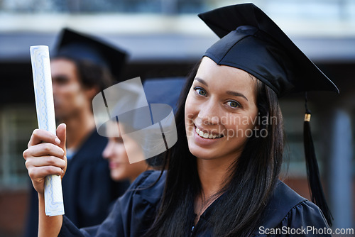 Image of Woman, student and portrait at graduation, scroll and university success or achievement. Female person, smile and pride at outdoor ceremony, higher education and degree or diploma for credential