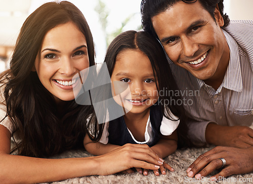 Image of Happy family, portrait and hug with love for bonding, support or relax together at home. Face of mother, father and little girl, child or young kid with smile for embrace, holiday or weekend on floor