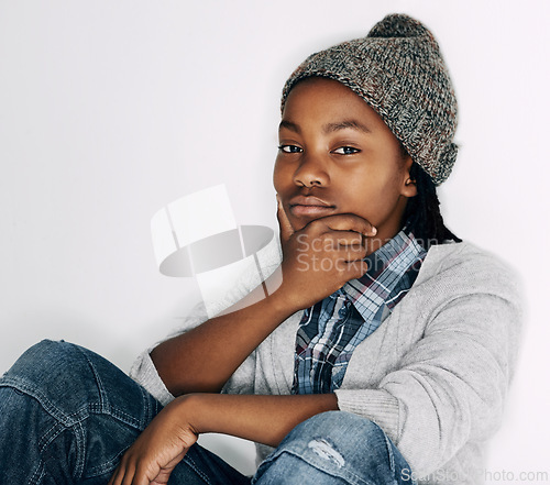 Image of Boy, fashion and portrait with gen z, trendy and cool style with a hat in a studio. Child, accessory and African male kid from Chicago with confidence and modern youth outfit with white background