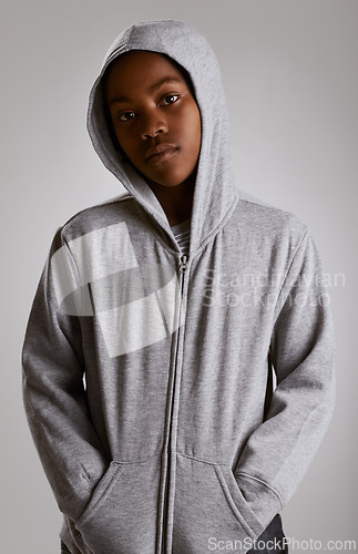 Image of Fashion, portrait and teenager in hoodie at studio with serious kid in streetwear on grey background. African, child and cool boy with casual style, clothes and comfortable with outfit in mockup