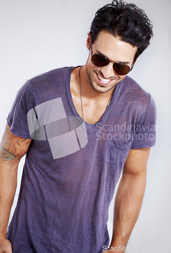 Image of Happy, man and fashion with sunglasses in studio with confidence in clothes, cool style and pride. Summer, holiday and person smile in casual outfit for vacation, break and relax on white background