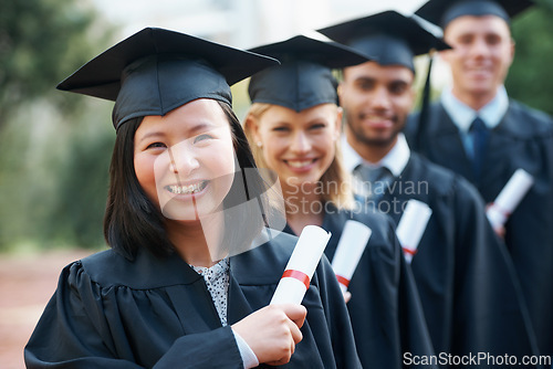 Image of Graduation, certificate and portrait of group at college ceremony in line with diploma and happiness. University, success and class of people with degree achievement, award and education scholarship