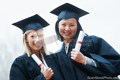 Image of Portrait, smile and graduation with student friends outdoor at overcast campus for certificate celebration. Face, education and success with college women at university for ceremony of tradition