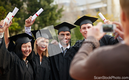 Image of Graduation, success and photograph of student friends outdoor on campus at university or college. Education, certificate and achievement with group of young graduate people together for picture