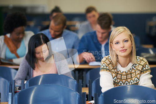 Image of University, students and portrait in course lecture and learning in classroom for education. College, campus and people studying for test in academy and reading project, research or knowledge