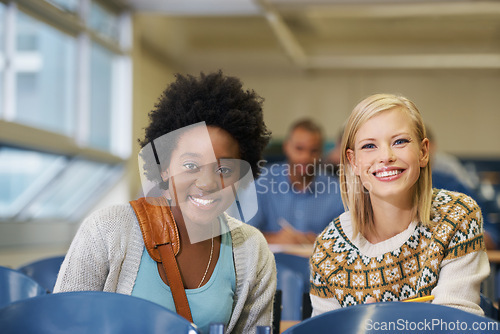 Image of Portrait, college and women students in classroom with positive, good and confident attitude. Smile, happy and young female friends with scholarship for academy in lecture hall at university.