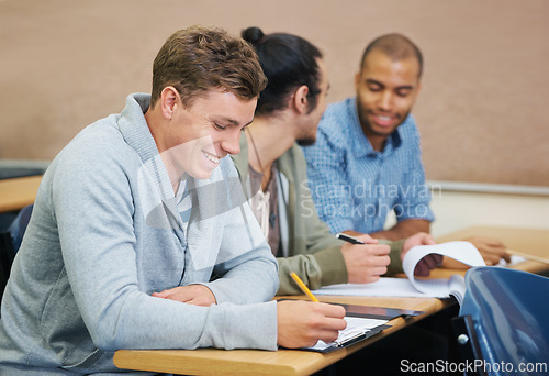 Image of Students, university and man writing test in classroom, information and notes for studying. People, books and knowledge in education for learning, problem solving and ideas for solution in assessment