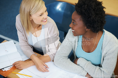 Image of Students, university and conversation in classroom, friends and discussing notes for studying. People, communication and knowledge in education for learning, problem solving and ideas for assessment